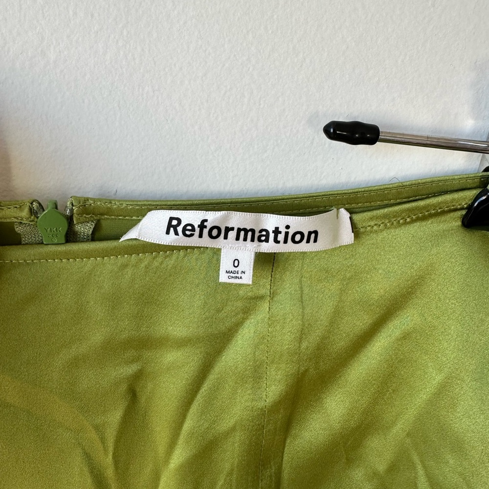 Reformation green mini skirt with slit. Gently worn.